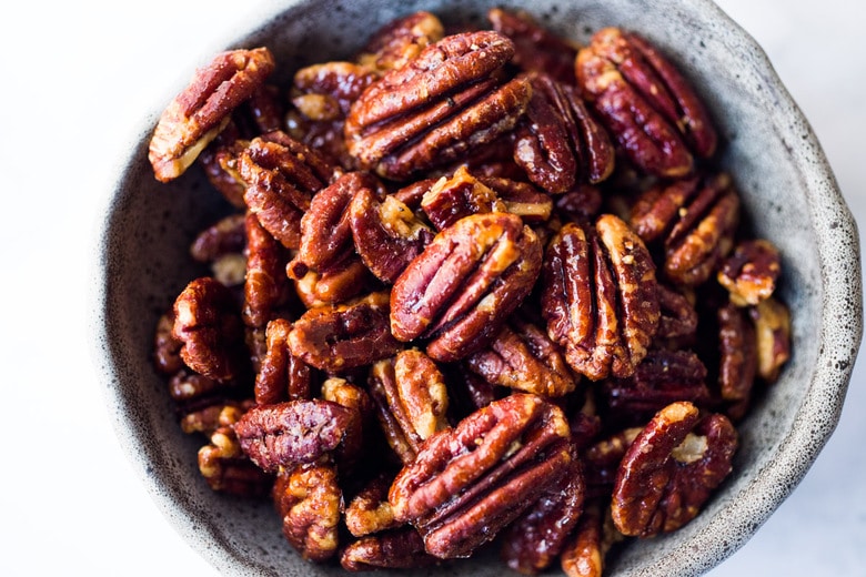 Maple-Roasted Candied Pecans made in just 15 minutes in the Oven. Only 3 ingredients! Oil free, Sugar Free, Vegan and totally foolproof! The BEST recipe that comes out perfect every time! #glazednuts #candiedpecans #maplepecans #pecans 