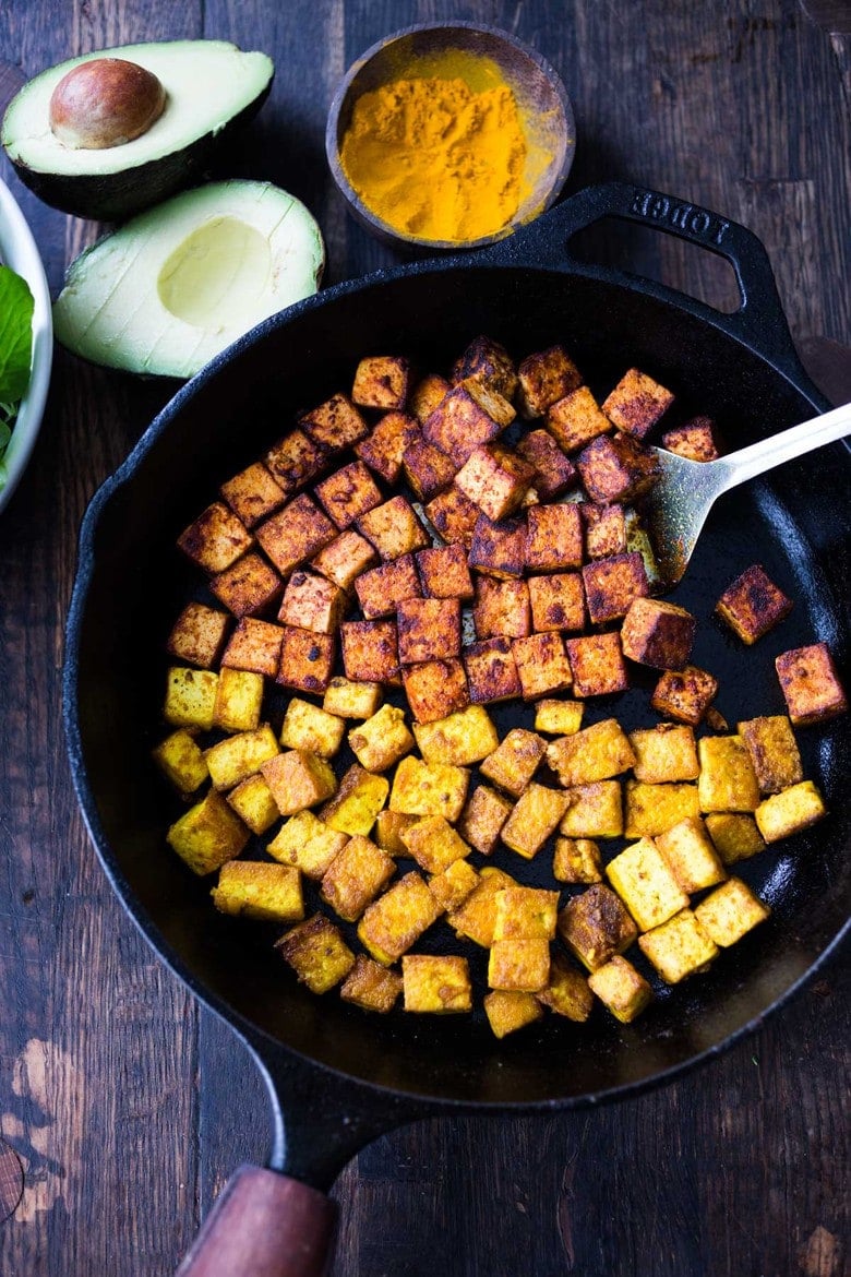 How to make flavorful Crispy Tofu on the stovetop in 20 minutes! You'll find a million uses for this crispy tofu and fun ways to season it - adding it to meals you are already making. #crispytofu #simpletofurecipes #easytofu #tofu #tofurecipes #friedtofu #stirfriedtofu