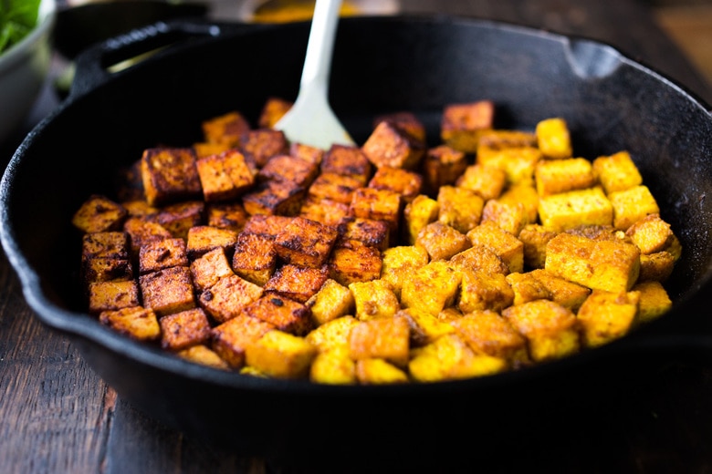 How to make flavorful Crispy Tofu on the stovetop in 20 minutes! You'll find a million uses for this crispy tofu and fun ways to season it - adding it to meals you are already making. #crispytofu #simpletofurecipes #easytofu #tofu #tofurecipes #friedtofu #stirfriedtofu