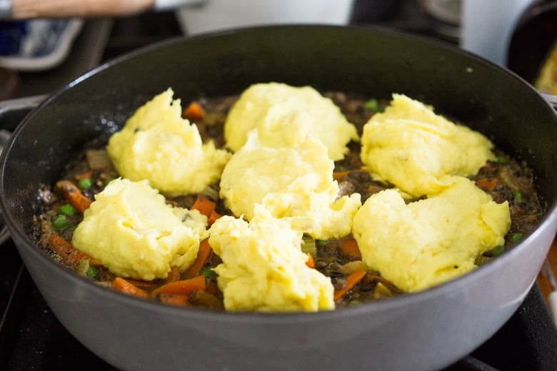 Indian-Spiced Shepherd's Pie with lentils, veggies and fragrant Garam Masala, topped with curry mashed potatoes. Truly one of the most delicious vegetarian recipes on the blog! #sheperdspie #vegetarianshepherdspie #indianrecipes #garammasala #lentils #vegetariandinner