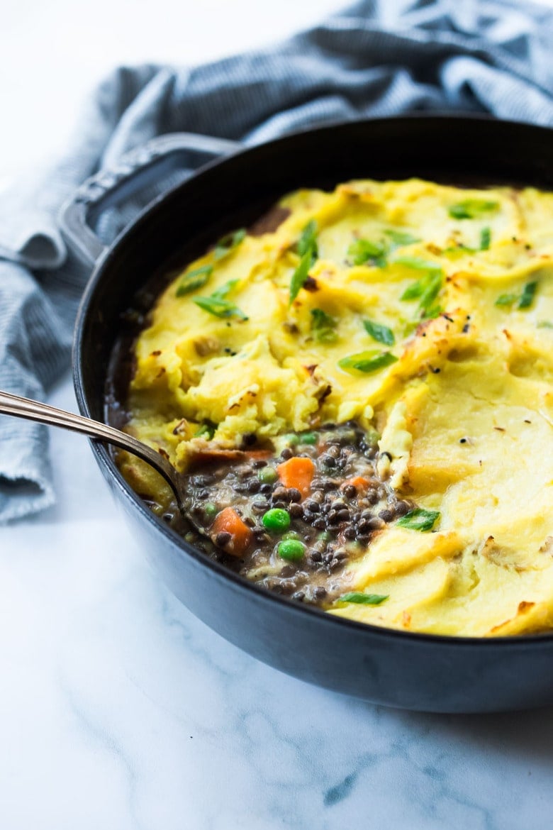 Vegetarian Shepherd's Pie with Indian spices, lentils, veggies and fragrant Garam Masala, topped with curry mashed potatoes. Truly one of the most delicious vegetarian recipes on the blog! #sheperdspie #vegetarianshepherdspie #indianrecipes #garammasala #lentils #vegetariandinner