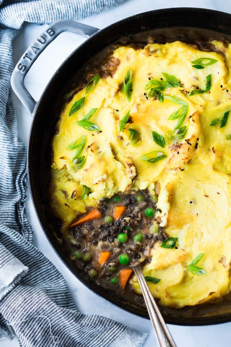 35 Delicious Indian Recipes to Make at Home | Indian-Spiced Shepherd's Pie with lentils, veggies and fragrant Garam Masala, topped with curry mashed potatoes. Truly one of the most delicious vegetarian recipes on the blog! #sheperdspie #vegetarianshepherdspie #indianrecipes #garammasala #lentils #vegetariandinner