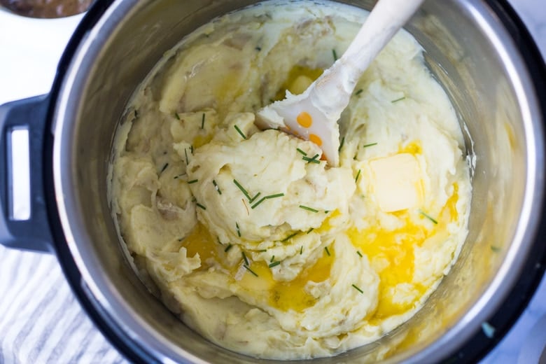instant pot mashed potatoes being stirred.