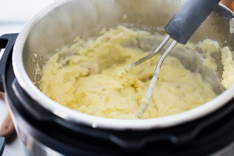 mashing the potatoes.