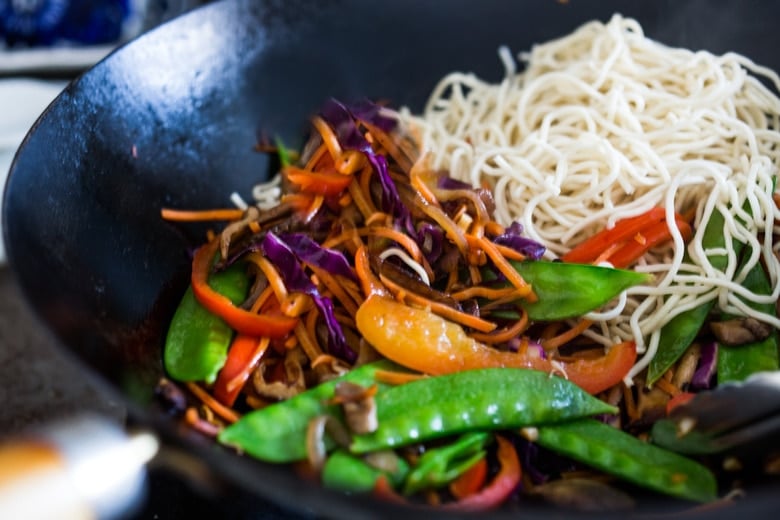 Veggie Lo Mein! On the table in under 20 minutes! Loaded up with healthy veggies, this VEGAN dinner recipe is fast and easy, perfect for busy weeknights! #lomein #lomeinnoodles #vegandinner #veganrecipes #veganlomein #stirfry
