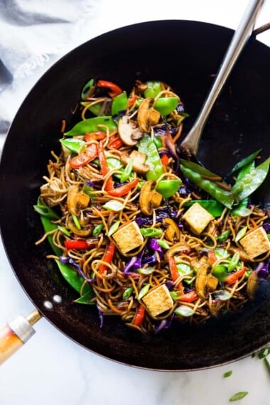 Veggie Lo Mein! On the table in under 20 minutes! Loaded up with healthy veggies, this VEGAN dinner recipe is fast and easy, perfect for busy weeknights! #lomein #lomeinnoodles #vegandinner #veganrecipes #veganlomein #stirfry