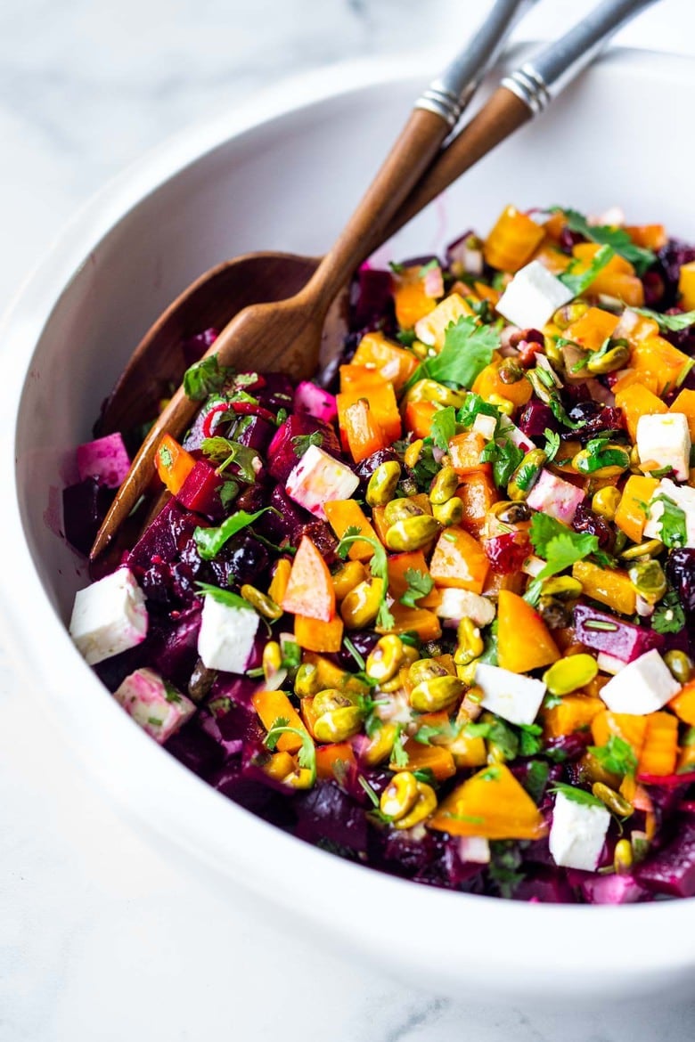 Truly one of the most beautiful and delicious Beet Salads with Pistachios, Feta, cilantro and orange in a simple citrus vinaigrette. Can be made ahead and keeps for 3 days in the fridge. #beetsalad #holidaysalad #goldenbeets #beets 