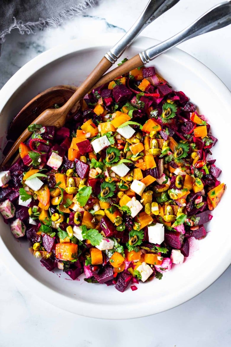 Truly one of the most beautiful and delicious Beet Salads with Pistachios, Feta, cilantro and orange in a simple citrus vinaigrette. Can be made ahead and keeps for 3 days in the fridge. #beetsalad #holidaysalad #goldenbeets #beets 