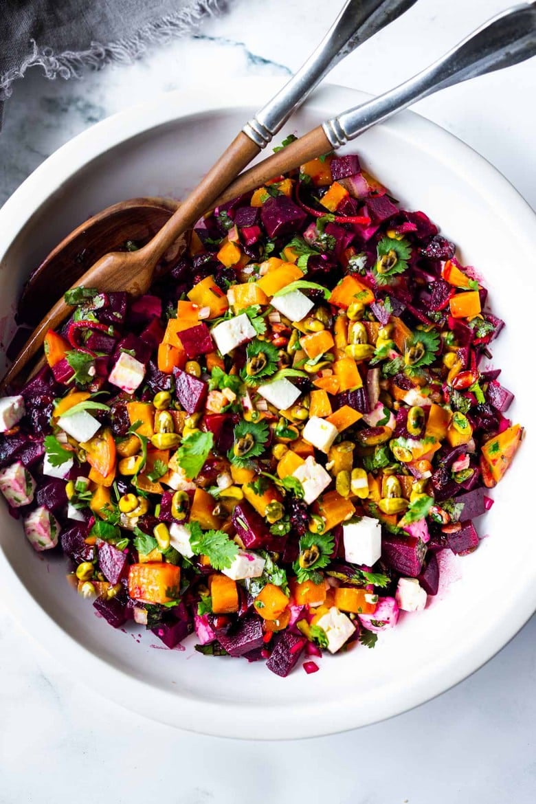 Truly one of the most beautiful and delicious Beet Salads with Pistachios, Feta, cilantro and orange in a simple citrus vinaigrette. Can be made ahead and keeps for 3 days in the fridge. #beetsalad #holidaysalad #goldenbeets #beets