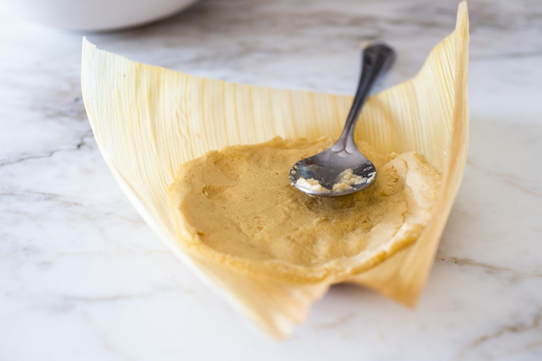 spreading the masa dough.