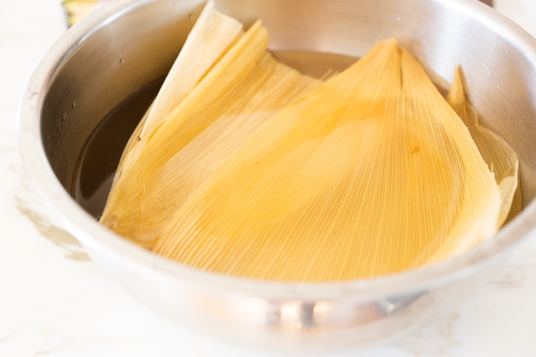 soaking the corn husks for tamales 