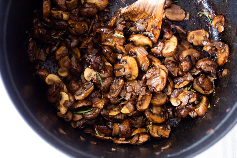 Creamy Mushroom Soup with Rosemary and Garlic - a delicious easy recipe that is Keto friendly and perfect for special gatherings or simple enough for weeknight dinners! Serve this with crusty bread for a simple hearty meal! #mushroomsoup #mushroomsouprecipe #mushroomrecipes #ketosoup