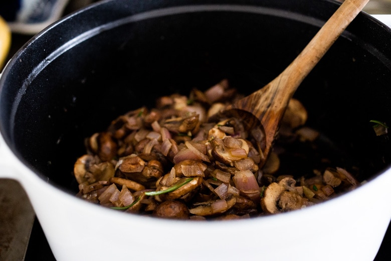 Creamy Mushroom Soup with Rosemary and Garlic - a delicious easy recipe that is Keto friendly and perfect for special gatherings or simple enough for weeknight dinners! Serve this with crusty bread for a simple hearty meal! #mushroomsoup #mushroomsouprecipe #mushroomrecipes #ketosoup