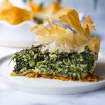 Spanakopita Pie - an easy, authentic, healthy recipe for spanakopita, made in a pie pan! #spanakopita #spinachrecipes #phyllo #spanakopitapie #phyllodough