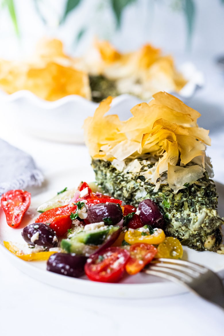 Spanakopita Pie - an easy, healthy recipe for spanakopita, with double the spinach filling, made in a pie pan! A delicious Greek-style lunch or brunch idea! Delicious served with a Simple Greek Salad! #spanakopita #spinachrecipes #phyllo #spanakopitapie #phyllodough