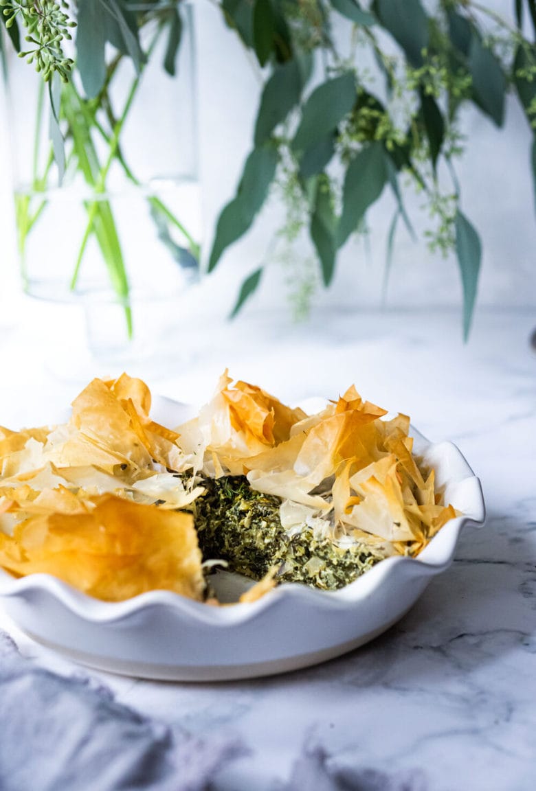 Spanakopita Pie - an easy, healthy recipe for spanakopita, with double the spinach filling, made in a pie pan! A delicious Greek-style lunch or brunch idea! Delicious served with a Simple Greek Salad! #spanakopita #spinachrecipes #phyllo #spanakopitapie #phyllodough