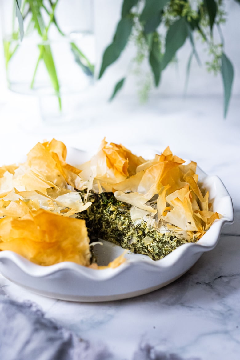 Spanakopita Pie - an easy, authentic, healthy recipe for Greek spanakopita, made in a pie pan! #spanakopita #spinachrecipes #phyllo #spanakopitapie #phyllodough