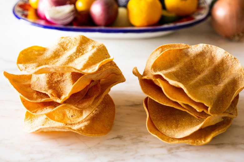 How to Make Chilaquiles! A classic Mexican dish made with stewed corn tortillas (or chips) that can be served as breakfast, lunch or dinner. The best part? This highly adaptable meal can be made in under 20 minutes, perfect for busy weeknights! #chilaquiles #vegetarian #mexican #rojo #verde