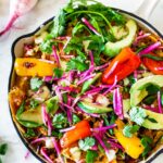 How to Make Chilaquiles! A classic Mexican dish made with stewed corn tortillas (or chips) that can be served as breakfast, lunch or dinner. The best part? This highly adaptable meal can be made in under 20 minutes, perfect for busy weeknights! #chilaquiles #vegetarian #mexican #rojo #verde