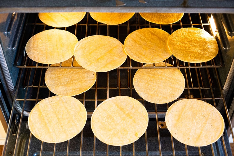 How to Make Chilaquiles! A classic Mexican dish made with stewed corn tortillas (or chips) that can be served as breakfast, lunch or dinner. The best part? This highly adaptable meal can be made in under 20 minutes, perfect for busy weeknights! #chilaquiles #vegetarian #mexican #rojo #verde