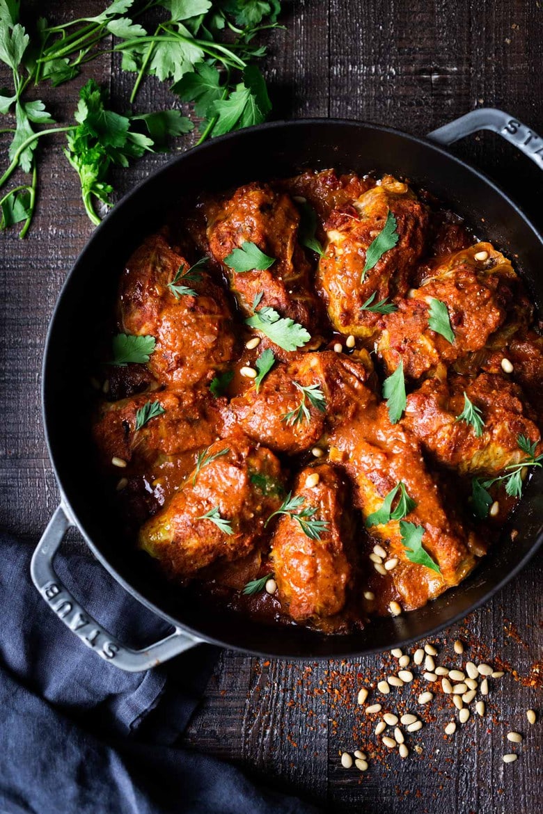 Turkish Cabbage Rolls - filled with ground lamb, bulgar, pine nuts and fragrant spices, bathed in the most delicious Turkish Tomato Sauce. #cabbagerolls #stuffedcabbage #turkishcabbagerolls #turkishrecipes #lambrecipes #cabbagerecipes 