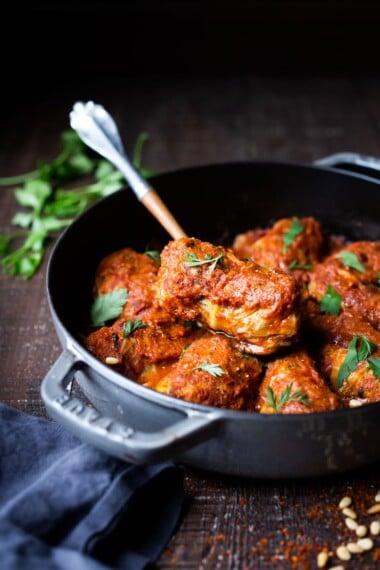 Turkish Stuffed Cabbage Rolls - filled with ground lamb, bulgar, pine nuts and fragrant spices, bathed in the most delicious Turkish Tomato Sauce. #cabbagerolls #stuffedcabbage #turkishcabbagerolls #turkishrecipes #lambrecipes #cabbagerecipes