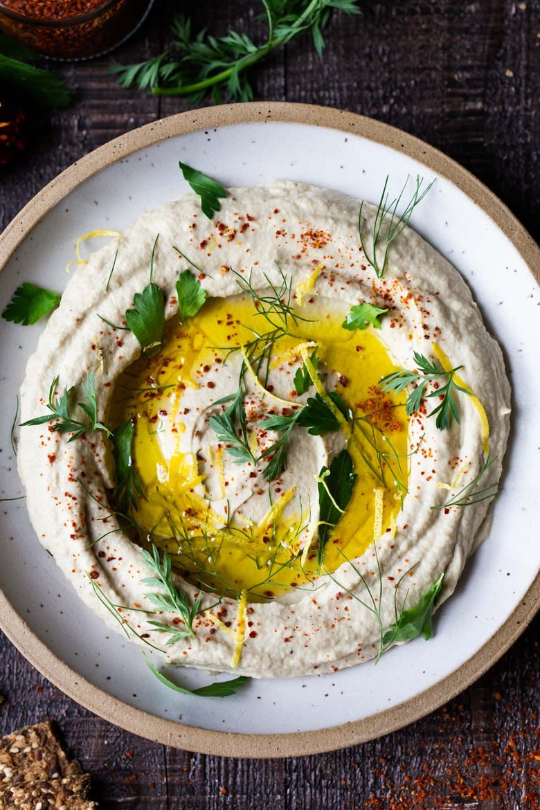 Lemony Artichoke White Bean Dip - a quick and easy Vegan Appetizer (a twist on "hummus") that can be made in 10 minutes flat. Great for parties and gatherings and made with simple pantry ingredients!