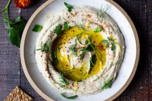 Lemony Artichoke White Bean Dip - a quick and easy Vegan Appetizer (a twist on "hummus") that can be made in 10 minutes flat. Great for parties and gatherings and made with simple pantry ingredients!