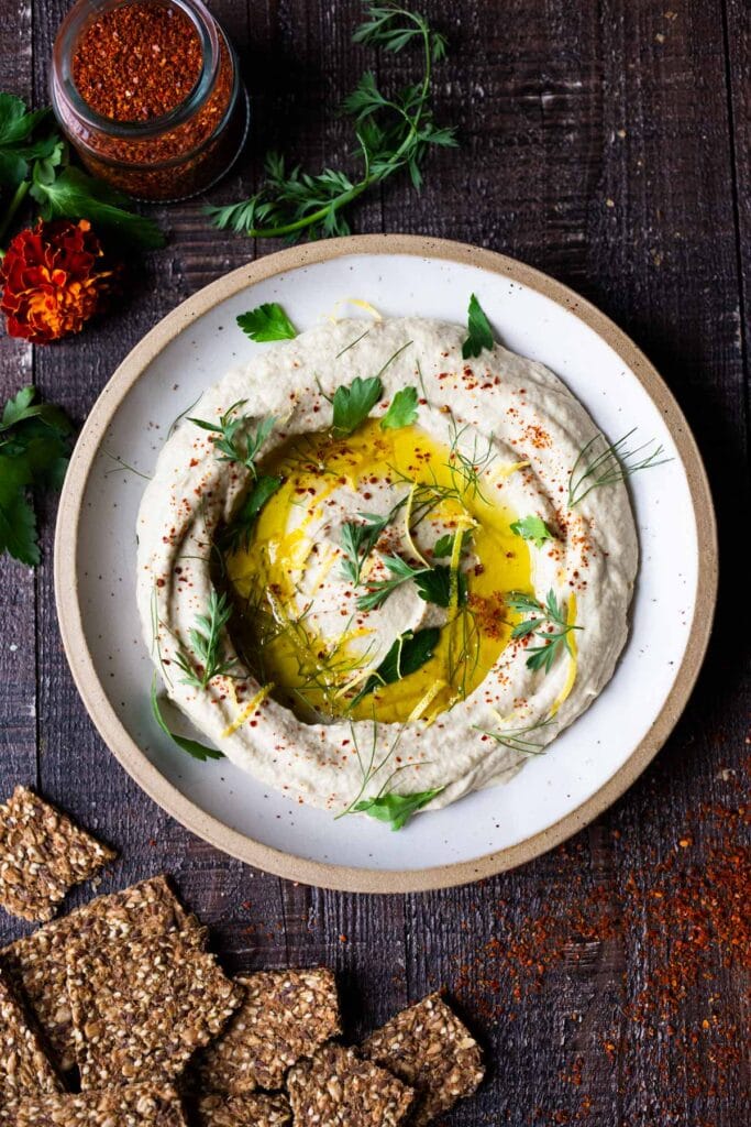 Lemony Artichoke White Bean Dip - a quick and easy Vegan Appetizer (a twist on "hummus") that can be made in 10 minutes flat. Great for parties and gatherings and made with simple pantry ingredients!