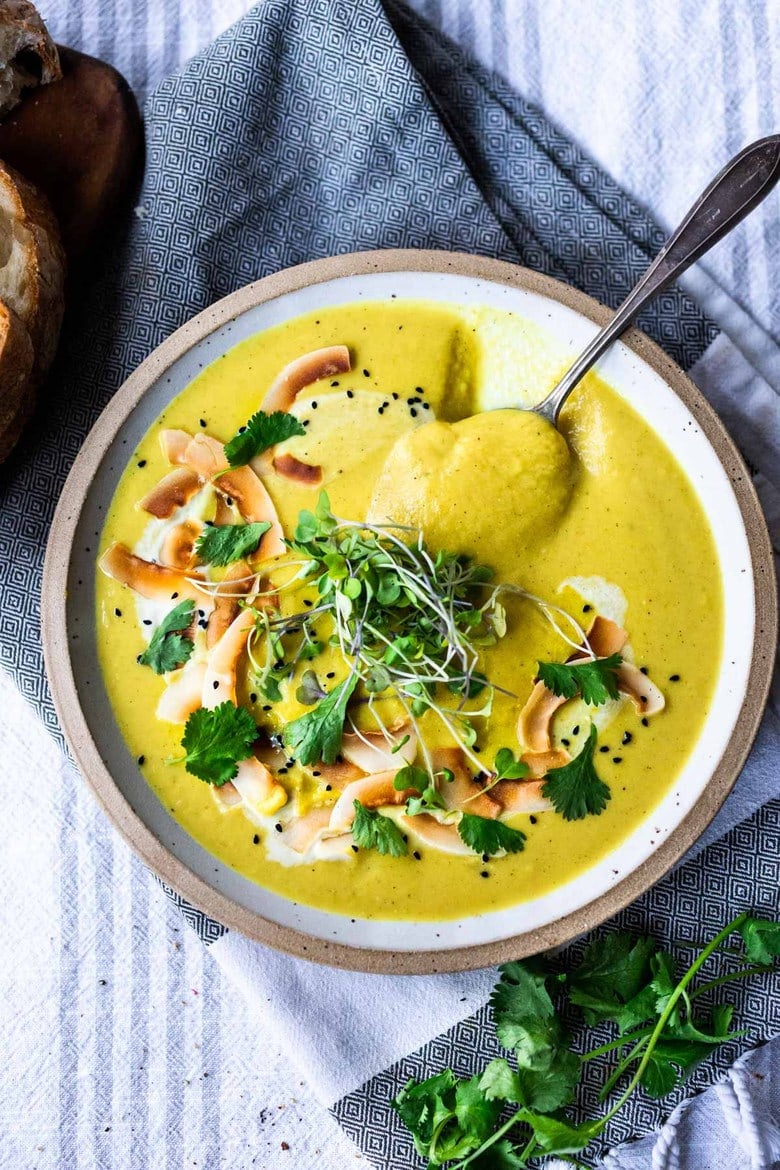 This Creamy Vegan Curried Cauliflower Soup with coconut milk, Indian spices, ginger and lime is simple and easy to make, and can be made in an Instant Pot (or on the stove top! Healthy and delicious! #vegan #vegansoup #instantpotsoup #cauliflowersoup #instantpot