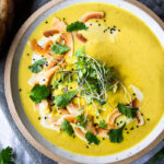 This Creamy Vegan Curried Cauliflower Soup with coconut milk, Indian spices, ginger and lime is simple and easy to make, and can be made in an Instant Pot (or on the stove top! Healthy and delicious! #vegan #vegansoup #instantpotsoup #cauliflowersoup #instantpot