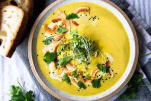 This Creamy Vegan Curried Cauliflower Soup with coconut milk, Indian spices, ginger and lime is simple and easy to make, and can be made in an Instant Pot (or on the stove top! Healthy and delicious! #vegan #vegansoup #instantpotsoup #cauliflowersoup #instantpot