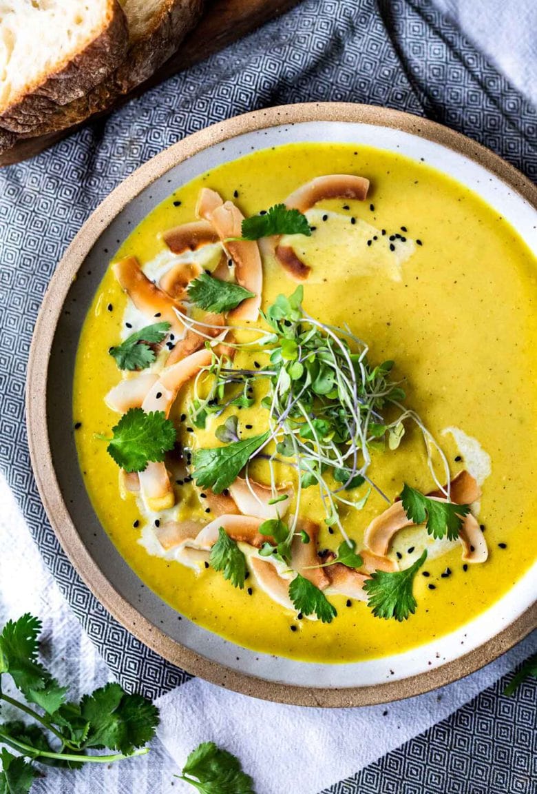 This Creamy Vegan Curried Cauliflower Soup with coconut milk, Indian spices, ginger and lime is simple and easy to make, and can be made in an Instant Pot (or on the stove top! Healthy and delicious! #vegan #vegansoup #instantpotsoup #cauliflowersoup #instantpot