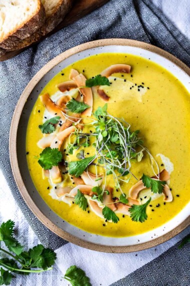 This Creamy Vegan Curried Cauliflower Soup with coconut milk, Indian spices, ginger and lime is simple and easy to make, and can be made in an Instant Pot (or on the stove top! Healthy and delicious! #vegan #vegansoup #instantpotsoup #cauliflowersoup #instantpot