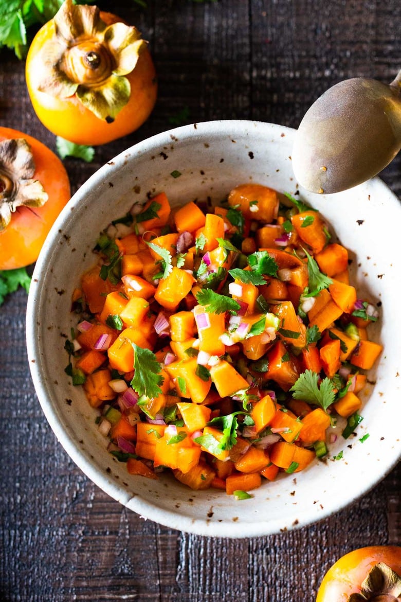 Persimmon Salsa Recipe! How to make the most delicious salsa in winter, using Fuyu Persimmons instead of tomatoes! Easy, quick and flavorful! Use this on fish tacos or like you would Pico de Gallo. #salsa #persimmons #persimmonrecipes #picodegallo 