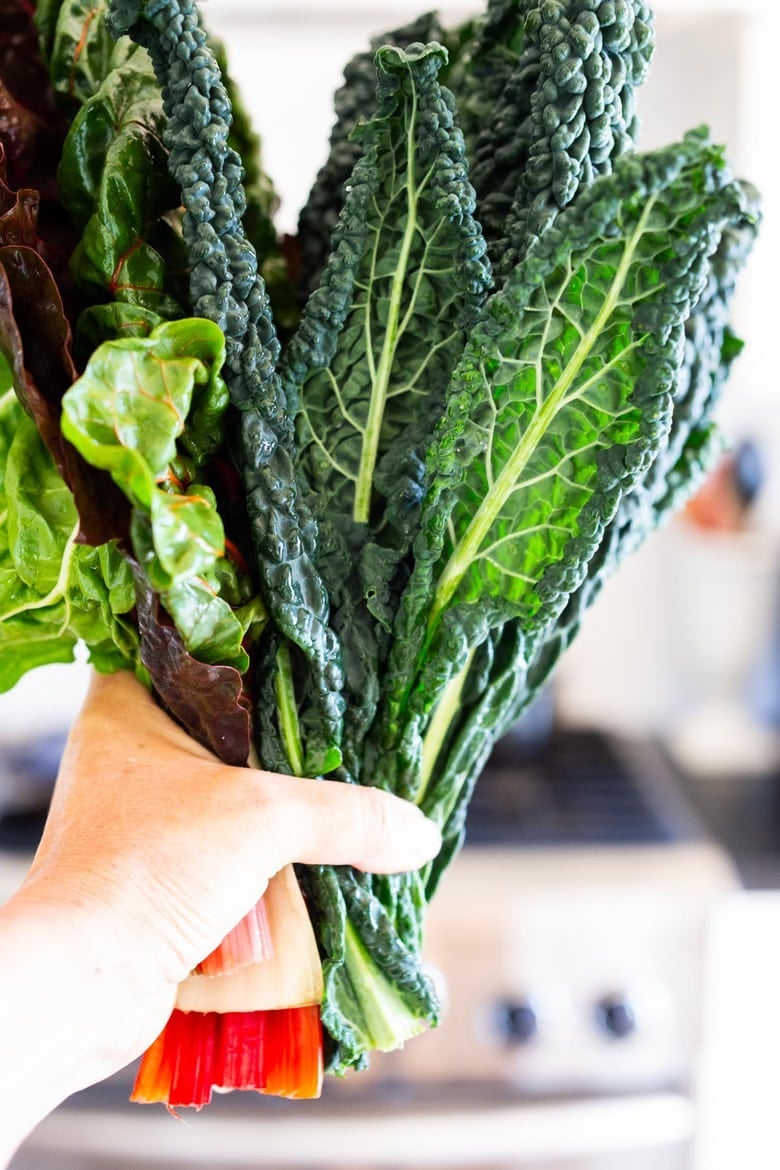 Sautéed kale and chard with garlic, shallots and lemon - a simple side dish that is vegan, low carb, Keto and full of healthy nutrients! Delicious flavor and can be made in 20 minutes! #sautéedkale #sautéedgreens, #wiltedkale, #ketosidedish, #vegansidedish,