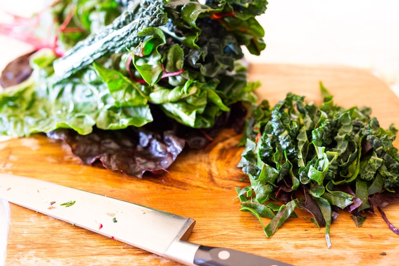 Sautéed kale and chard with garlic, shallots and lemon - a simple side dish that is vegan, low carb, Keto and full of healthy nutrients! Delicious flavor and can be made in 20 minutes! #sautéedkale #sautéedgreens, #wiltedkale, #ketosidedish, #vegansidedish,