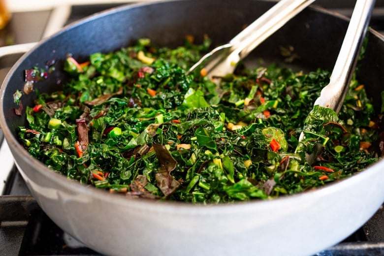 Sautéed kale and chard with garlic, shallots and lemon - a simple side dish that is vegan, low carb, Keto and full of healthy nutrients! Delicious flavor and can be made in 20 minutes! #sautéedkale #sautéedgreens, #wiltedkale, #ketosidedish, #vegansidedish,