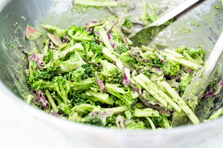 This Creamy Vegan Broccoli Salad is so good, you won't even realize it is vegan! Tossed in a creamy Hemp Dressing- it is easy, healthy and full of flavor! Vegan and Keto! #hempdressing #hemp #broccolisalad #keto #vegansalad #ketosalad 