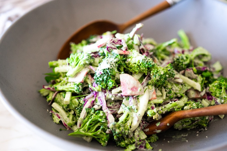 This Creamy Vegan Broccoli Salad is so good, you won't even realize it is vegan! Tossed in a creamy Hemp Dressing- it is easy, healthy and full of flavor! Vegan and Keto! #hempdressing #hemp #broccolisalad #keto #vegansalad #ketosalad 