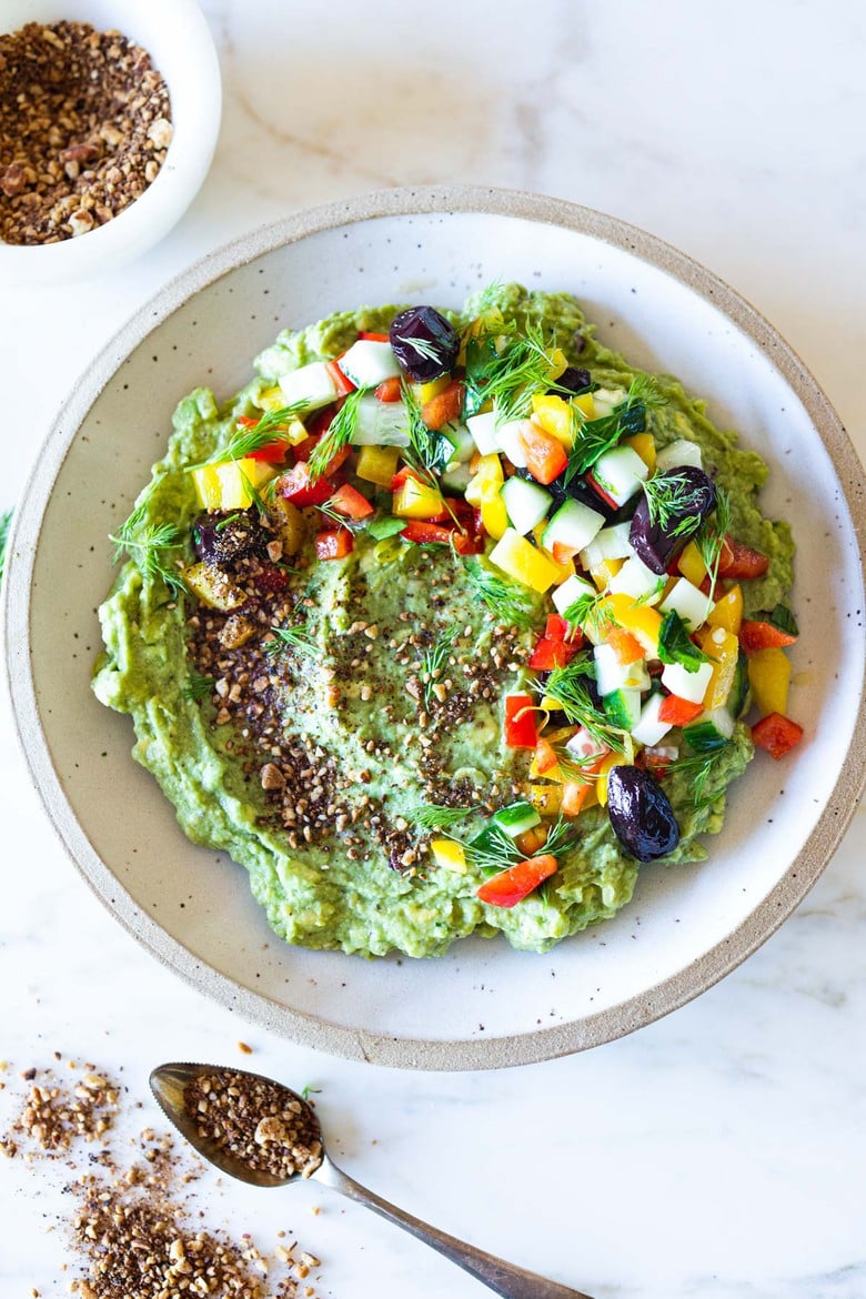 How to make the most delicious Guacamole-3 different ways. Like this Middle Eastern Version with Israeli Salad and Dukkah! (Traditional, Furikake and Middle Eastern!)Your Guac will never be boring again! Vegan, gluten-free and healthy. #guac #furikake #guacamole #guacamolerecipe #avocadodip #superbowl 