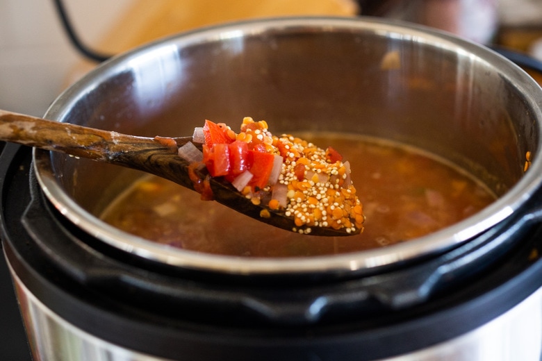 This hearty nourishing Moroccan Red Lentil Quinoa Soup is vegan, easy to make and made with simple everyday ingredients. Flavorful and aromatic, the warming spices are especialluy cozy. This can be made in under 30 minutes in an Instant Pot or on the stovetop and keeps well for midweek meals. 