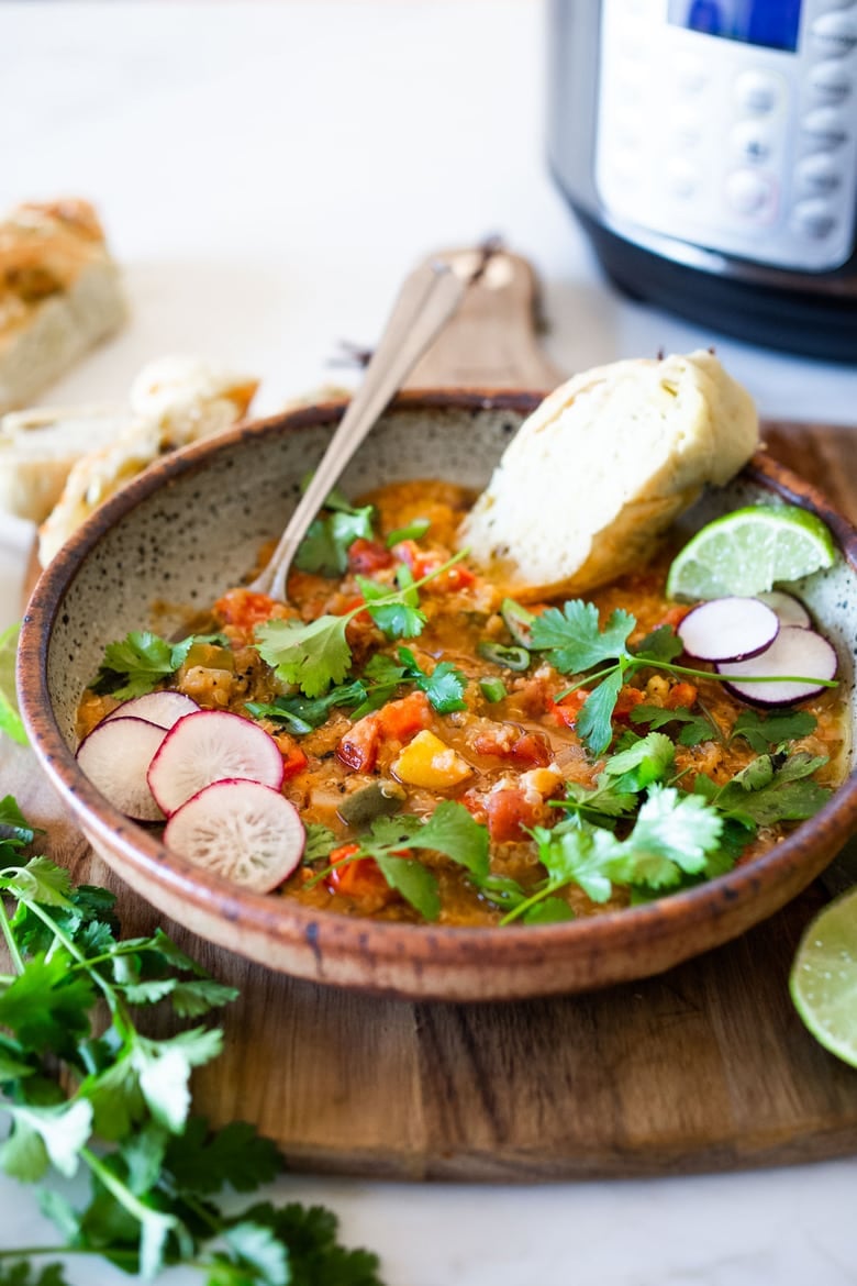 This hearty nourishing Moroccan Red Lentil Quinoa Soup is vegan, easy to make and made with simple everyday ingredients. Flavorful and aromatic, the warming spices are especialluy cozy. This can be made in under 30 minutes in an Instant Pot or on the stovetop and keeps well for midweek meals. 