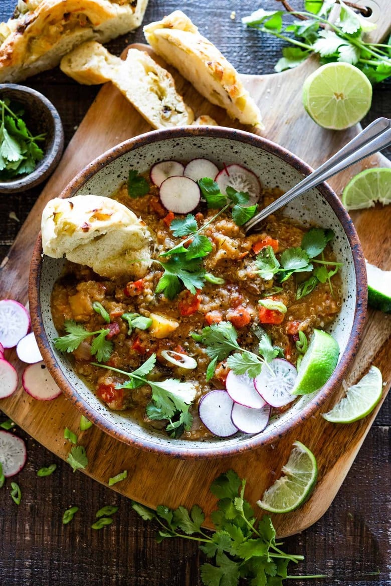 This hearty nourishing Moroccan Red Lentil Quinoa Soup is vegan, easy to make and made with simple everyday ingredients. Flavorful and aromatic, the warming spices are especialluy cozy. This can be made in under 30 minutes in an Instant Pot or on the stovetop and keeps well for midweek meals. #vegansoup #redlentisoup #quinoasoup #moroccansoup #moroccanstew #veganstew #instantpotsoup #instantpot 