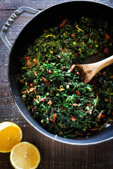 Simple Vegan Sautéed Greens- Kale and chard with garlic, shallots and lemon - a simple side dish that is vegan, low carb, Keto and full of healthy nutrients! Delicious flavor and can be made in 20 minutes! #sautéedkale #sautéedgreens, #wiltedkale, #ketosidedish, #vegansidedish,