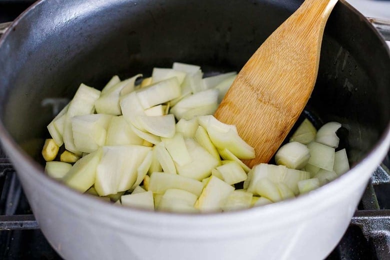 onions sautéing in a pot