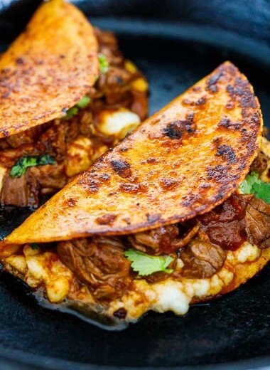 Learn the secret to the authentic Mexican birria. Make birria tacos, or enjoy as a stew topped with pickled onions, cilantro, and lime juice. Video.
