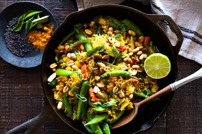This vibrant, turmeric-spiced Indian Fried Rice is packed with colorful, nutrient-rich veggies and comes together in under 30 minutes. Vegetarian, gluten-free, and easily adaptable for a vegan diet, it's a quick, wholesome, and flavorful weeknight meal that everyone will love.