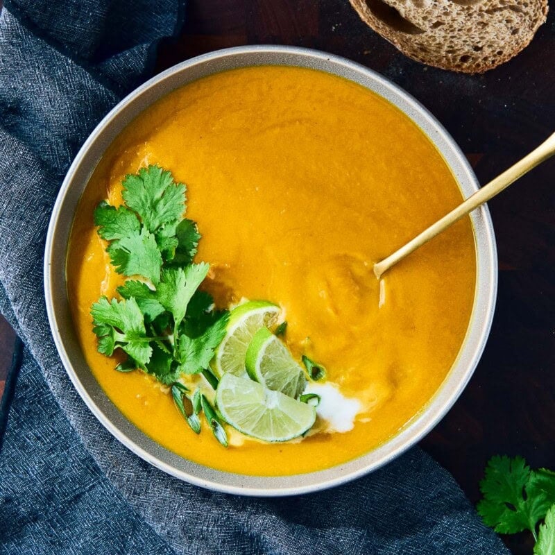 A healthy, Thai-inspired Sweet Potato Soup made with lemongrass, ginger, lime, and coconut milk. Creamy, comforting, flavorful-and fully vegan and gluten-free.