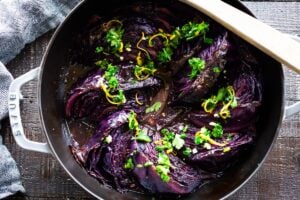 Slow Braised Cabbage - slow cooked in the oven until meltingly tender, topped with Gremolata. Vegan and Gluten-free. #cabbage #braisedcabbage